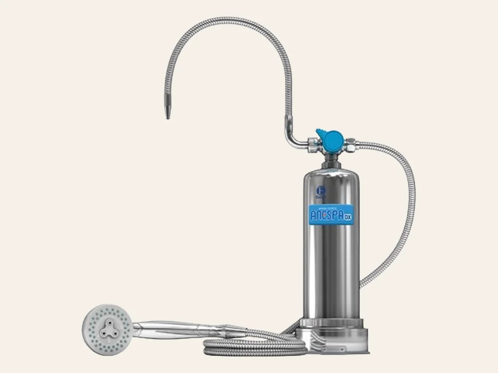 Enagic Anespa DX mineral ion water activator — stainless steel unit with massaging shower head and flexible hose